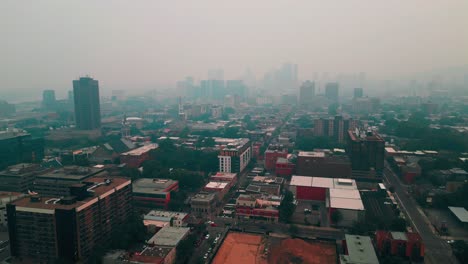 drone-shot-of-the-Smog-in-Montreal-from-le-village-in-direction-of-downtown