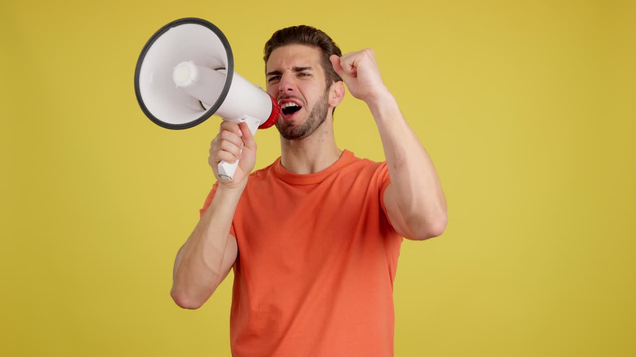 Man shouting and making a point with a megaphone