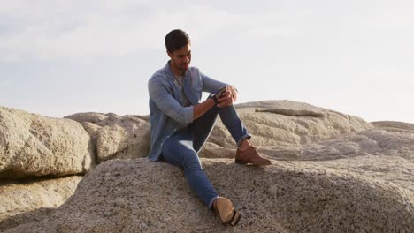 Young-man-looking-at-his-phone