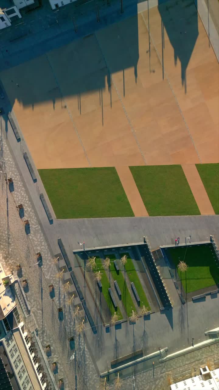 Rising social media ratio aerial GV video of Ebrington Square in Derry, County Londonderry in Northern Ireland. Filmed in 1080x1920, 60FPS and with Rec709 color