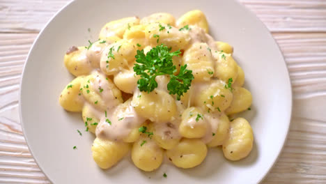 gnocchi with mushroom cream sauce and cheese - italian food style