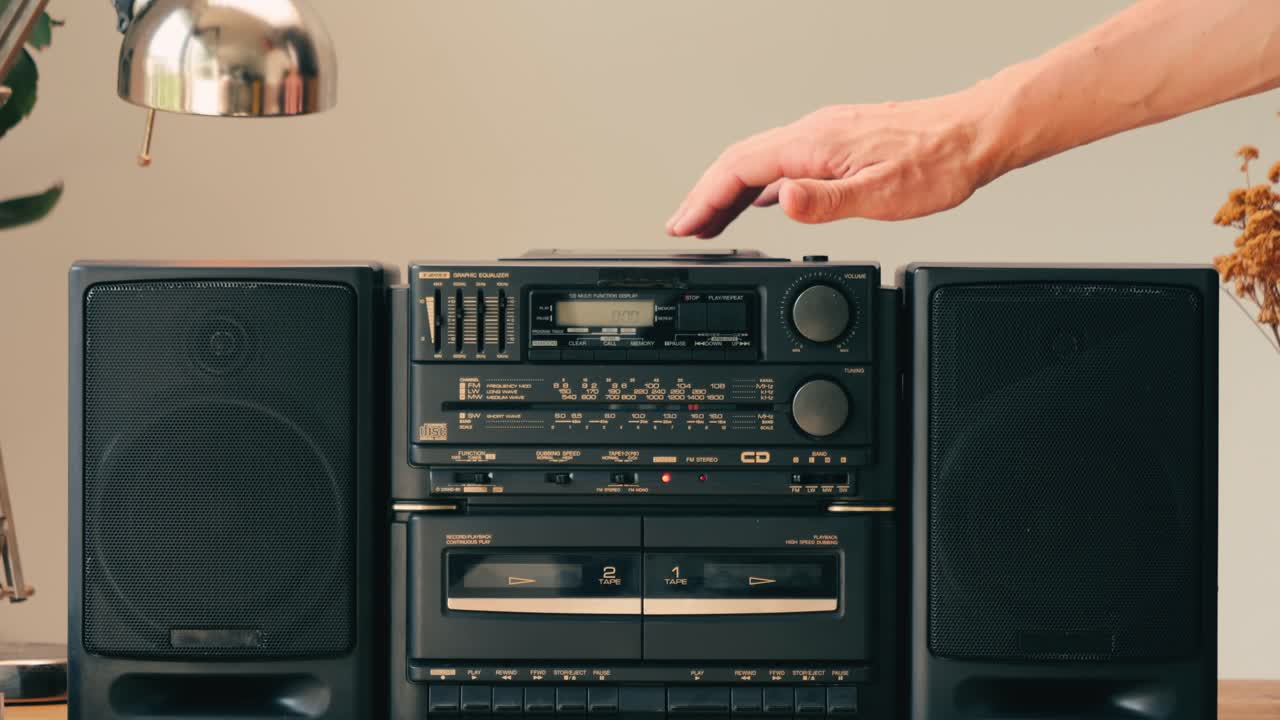 Retro radio tape recorder, audio cassette close-up. Listening to music, old radio boom box player, macro of vintage music listening. . High quality 4k footage