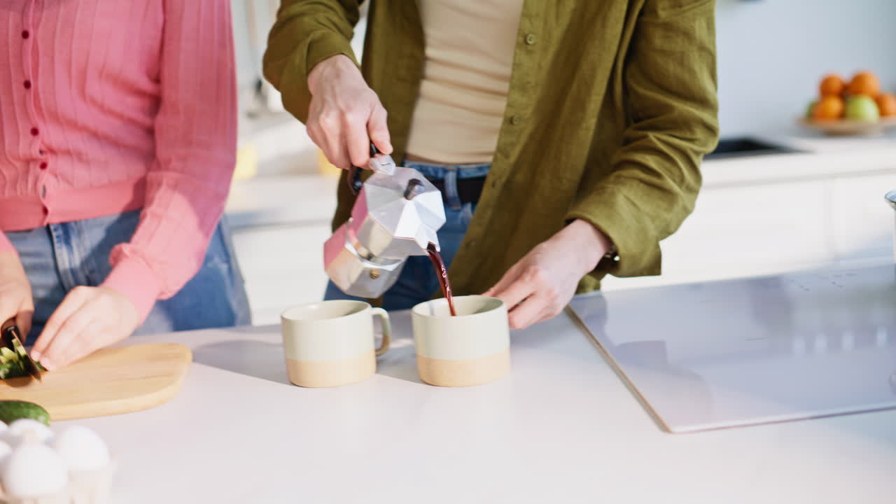 Girlfriend cutting salad vegetables in kitchen closeup. Lesbian couple cooking