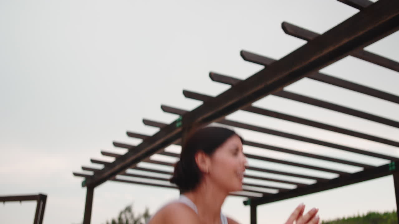 Woman doing squats outdoors