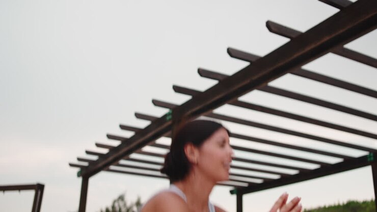 Woman doing squats outdoors