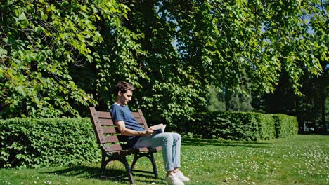 man reading in a park