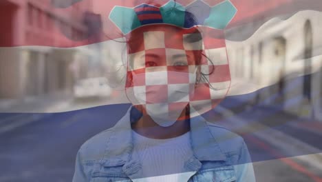 Animation-of-flag-of-croatia-waving-over-woman-wearing-face-mask-during-covid-19-pandemic