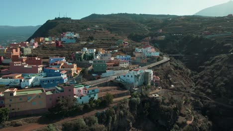 Establishing-Drone-Shot-of-Village-Houses-on-Anaga-Mountains-in-Spain