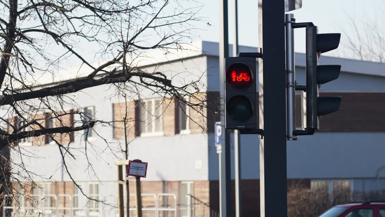 Traffic light changing from red to green for pedestrians and bicycles