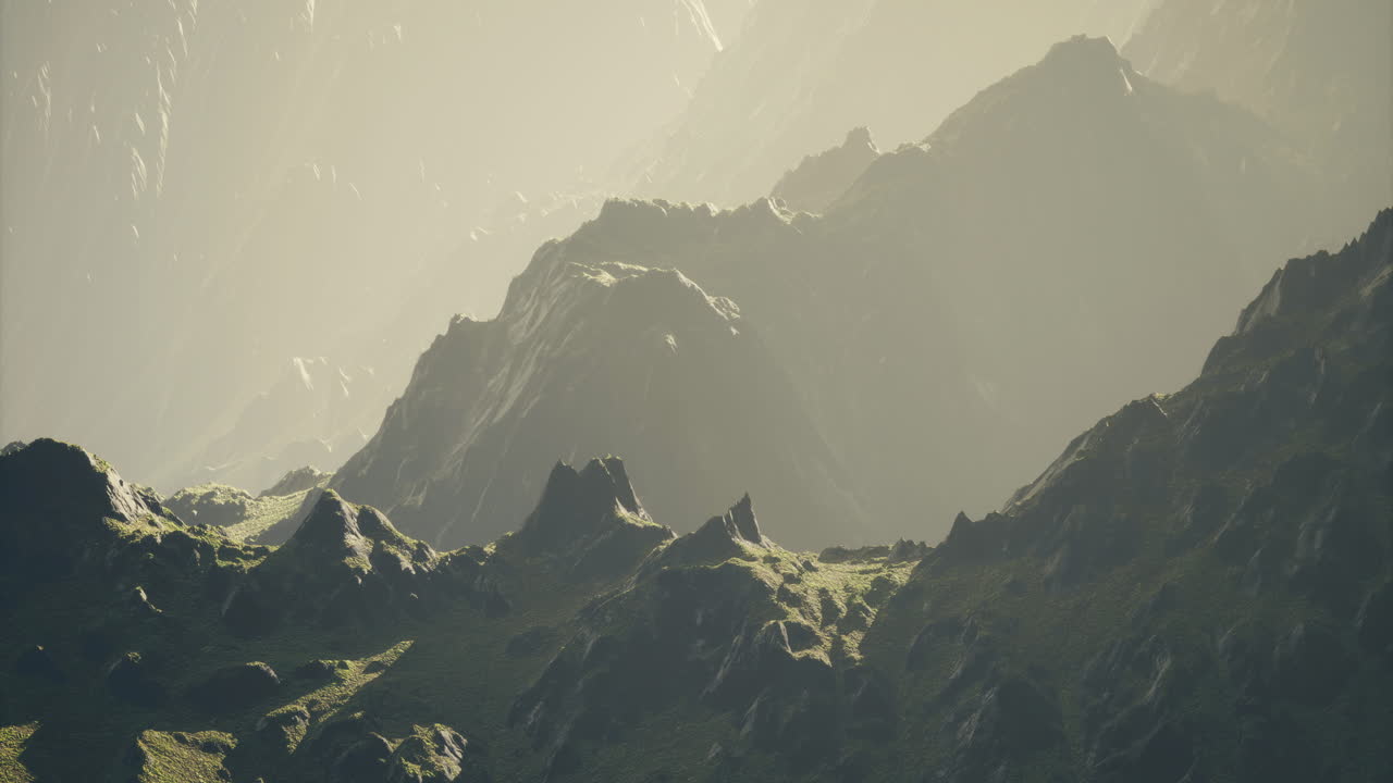 Majestic mountain landscape bathed in soft golden light at dawn