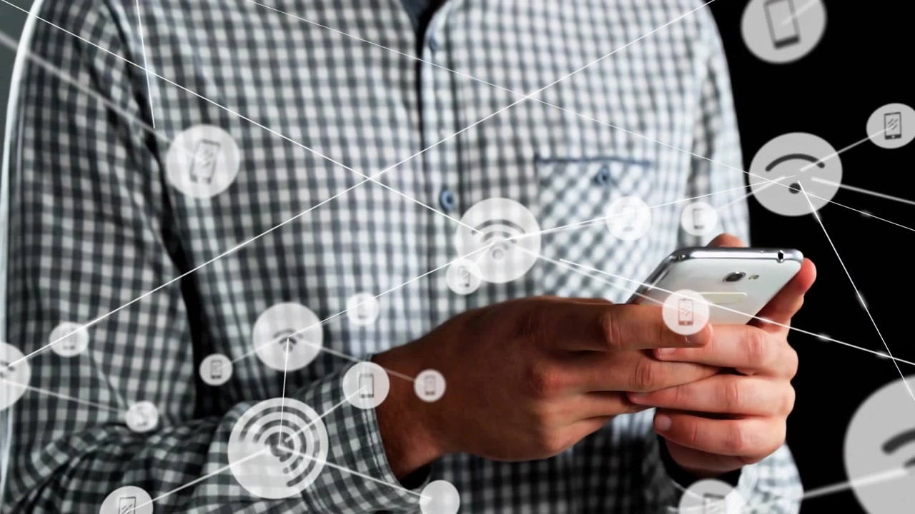 Man holding smartphone activating tech nodes fanning out on backdrop demonstrating connectivity