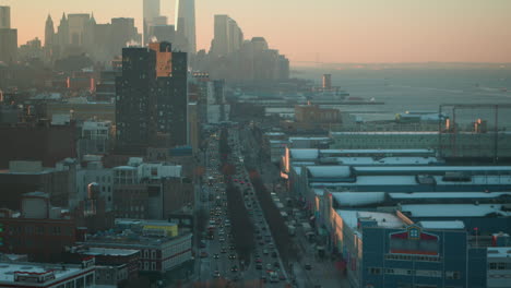 new york skyline, chelsea piers, hudson river with one world observatory in nyc