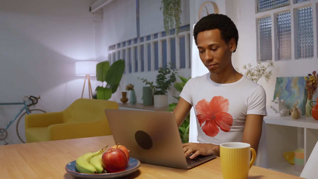 A person working on a laptop at home