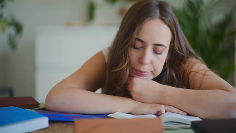 tired female student doing homework