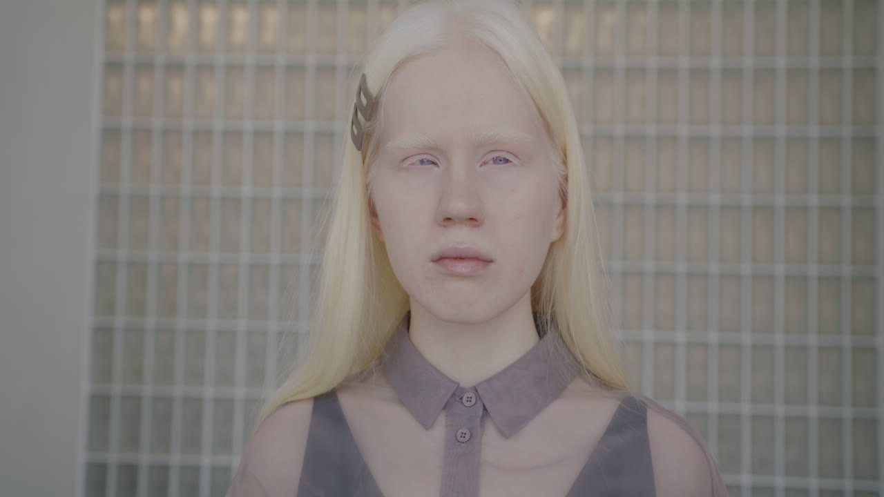 Portrait of a young blonde girl with pale skin