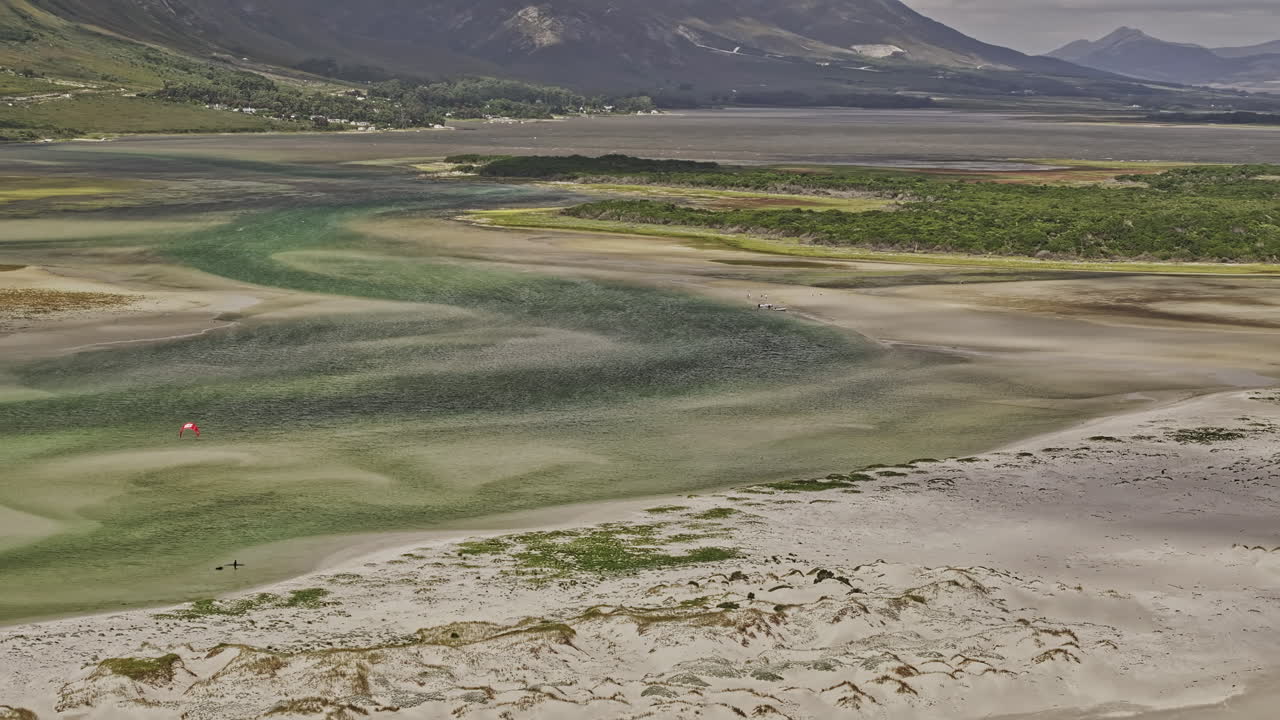 Hermanus South Africa Aerial v4 zoomed birds eye view flyover Grotto Beach capturing the serene beauty of Klein River Lagoon and coastal mountain landscape - Shot with Mavic 3 Pro Cine - Jan 8th 2024