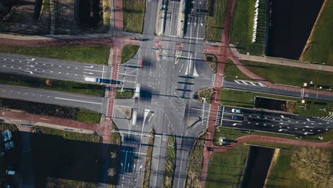 Aerial-hyperlapse-showing-buildings,-cars-and-city-landscape