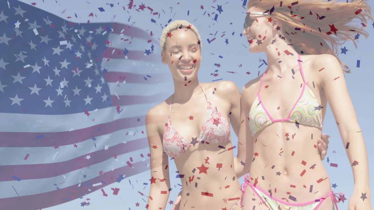 Naiset kävelevät käsikynkässä matkamainoksessa, saaden konfetin pyörteilemään läpinäkyvän Amerikan lipun ympärillä.
