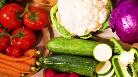 assorted vegetables displayed on a wooden background