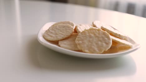 round cookies in white chocolate on a white table. sweet morning.