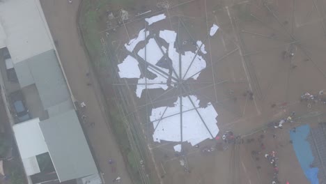 Top-down-view-of-giant-kite-frame-at-Sumpango-Kite-Festival,-aerial