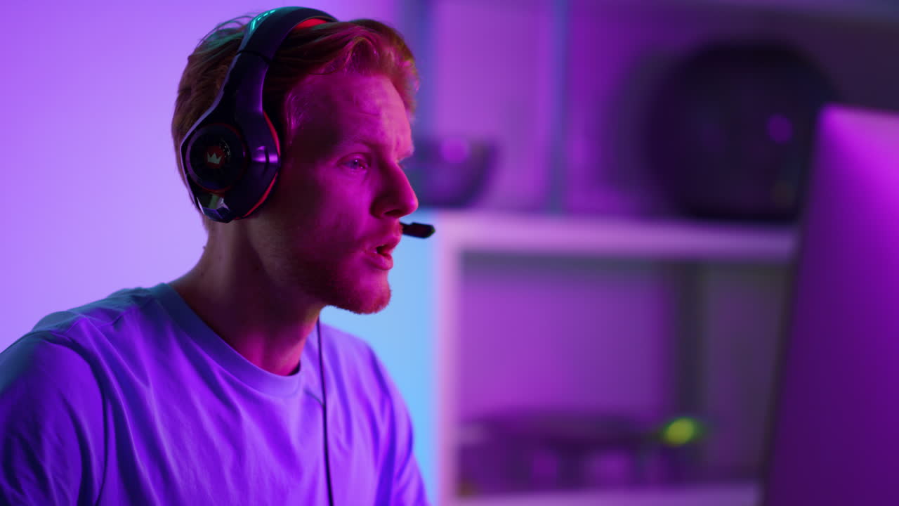 Disappointed gamer playing video game at home closeup. Upset man losing battle