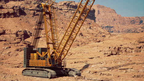 large construction crane at work in a rugged desert landscape