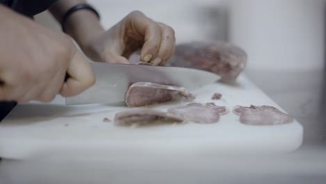 chef preparing sliced beef tongue