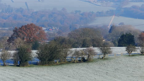 establishing aerial drone shot 7x panning up to look across the valley from calverley towards horsforth and rawdon on frosty morning uk