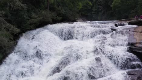 Waterfall-Cascading-over-Rocks-in-Appalachian-Mountain-Forest,-Aerial-Closeup