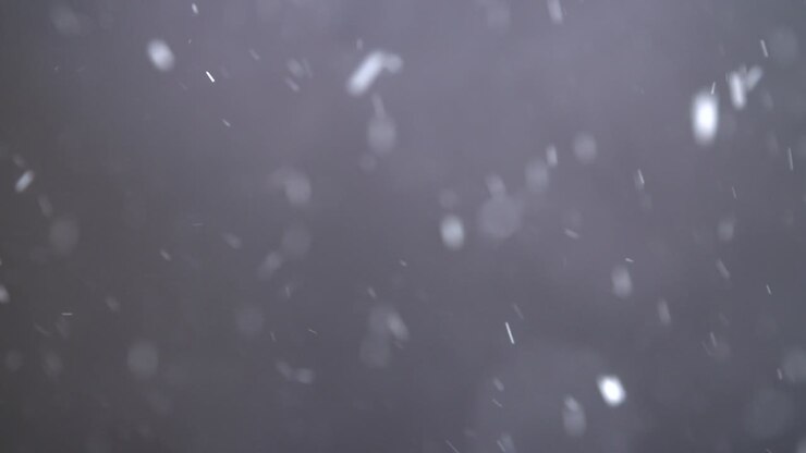 Slow Motion Snowfall On Black Background