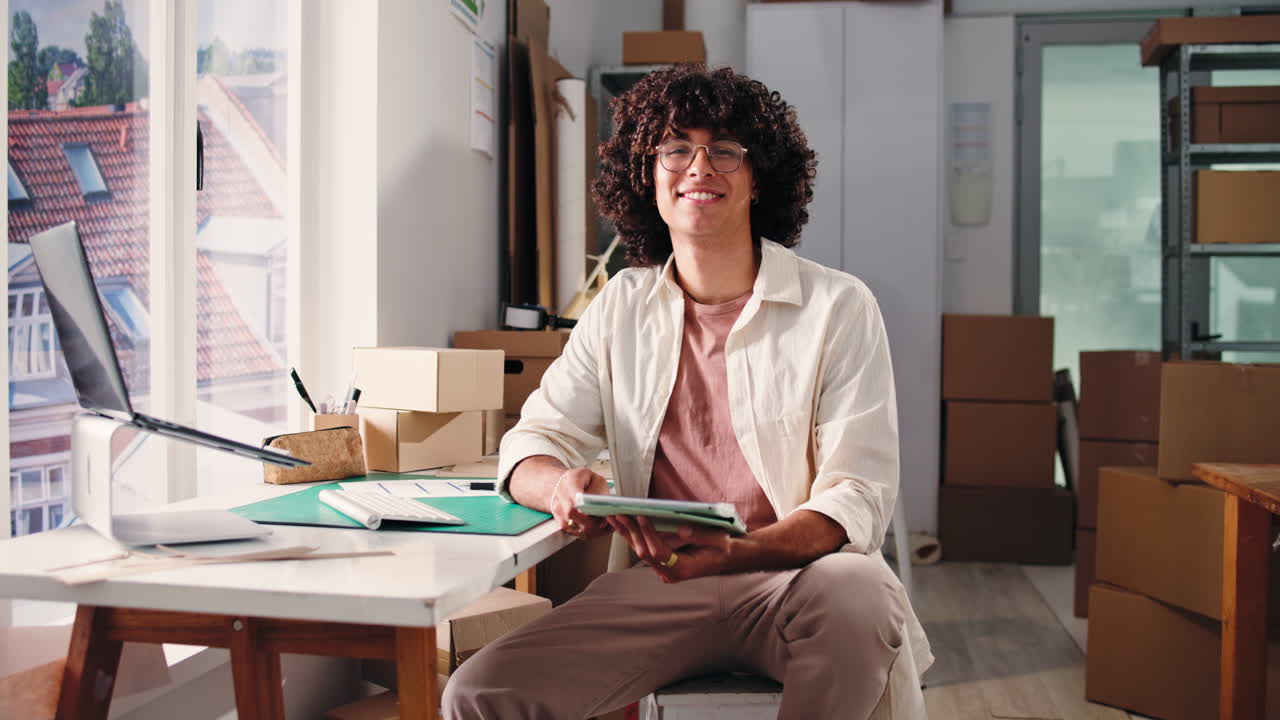Young Entrepreneur Working with Tablet in Small Business Office