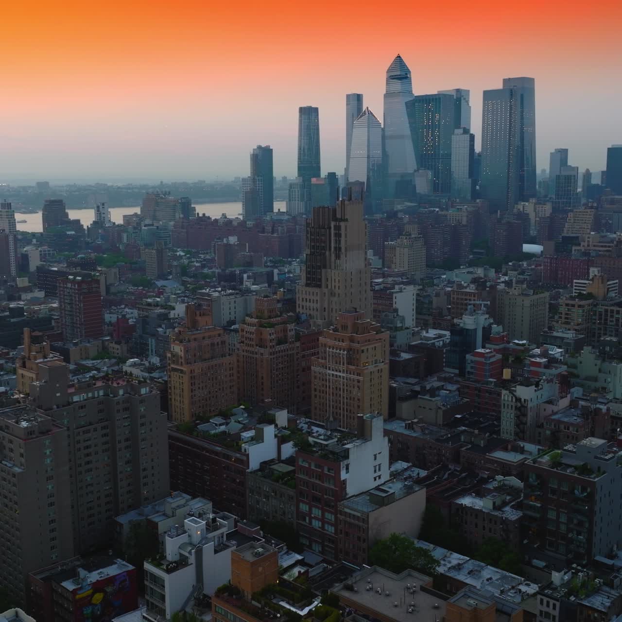 Unbelievable panorama of stunning New York architecture against beautiful orange sky. Metropolis at backdrop. Top view