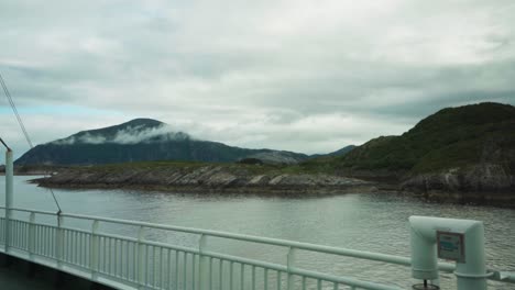 passenger's pov on ferry boat cruising in the sea with mountain views in onoy, islan