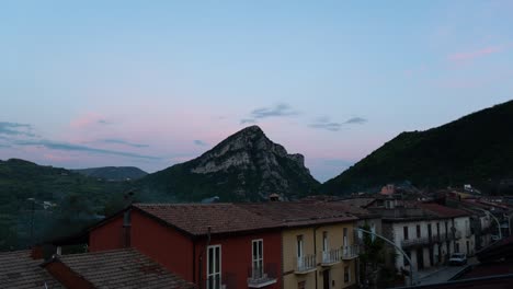 time lapse of an italian village and monte cigno peak, in the apennine mountains, during sunset