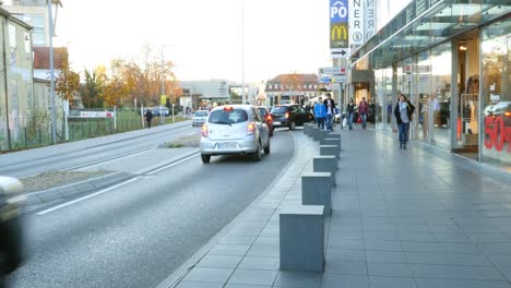 city street scene with shops and traffic