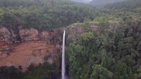 advancing aerial of amazing, tall lone creek waterfall in south africa