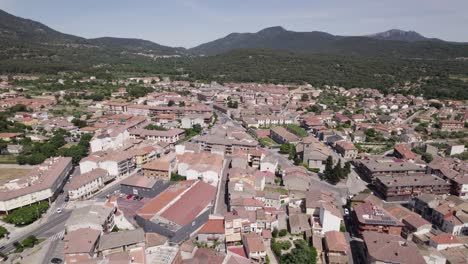 spanish village in foreground of mountainous landscape background