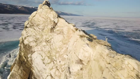 frozen lake baikal with rocky coastline