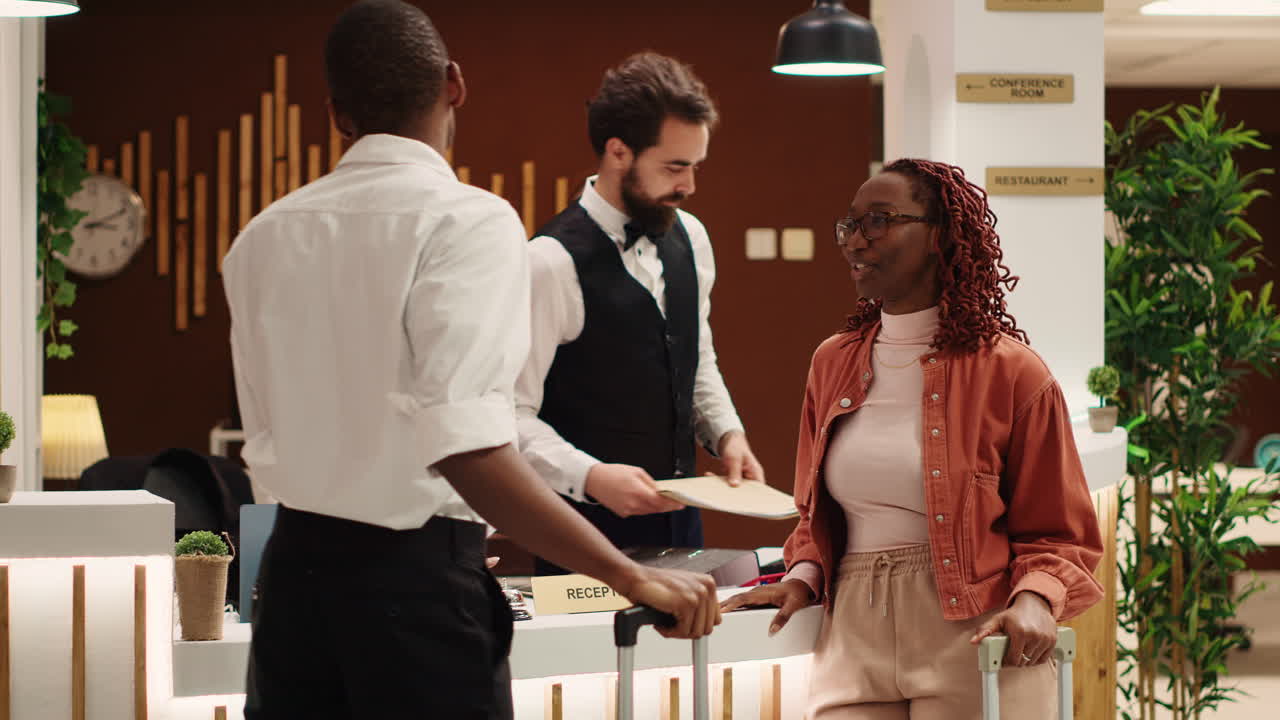 Couple checking out from luxury hotel