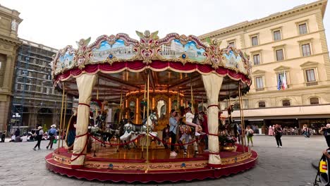 colorful carousel spinning in florence's historic square