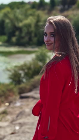 woman relaxing in mountains. carefree happy woman enjoying nature. vertical video
