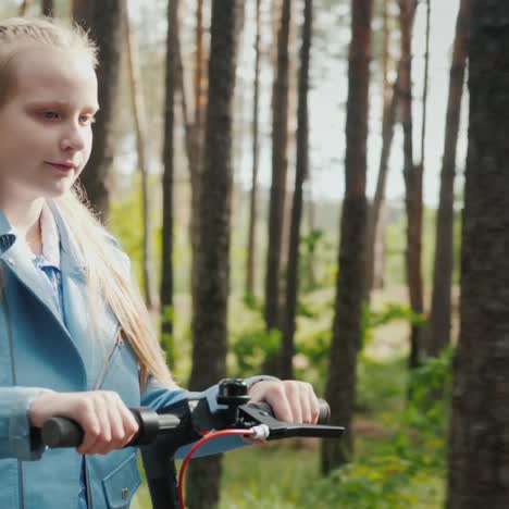 Girl-Rides-Electric-Scooter-In-Park