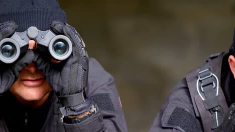 Close-up-of-caucasian-military-soldiers-looking-through-binoculars-during-training-at-base-4k