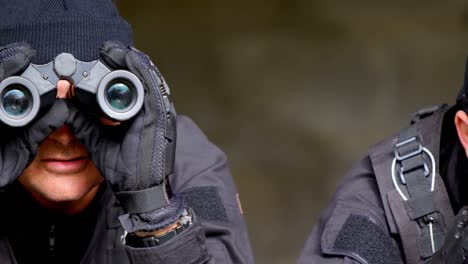 close-up of caucasian military soldiers looking through binoculars during training at base 4k