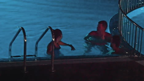 swimming pool at a luxury, tropical resort at night