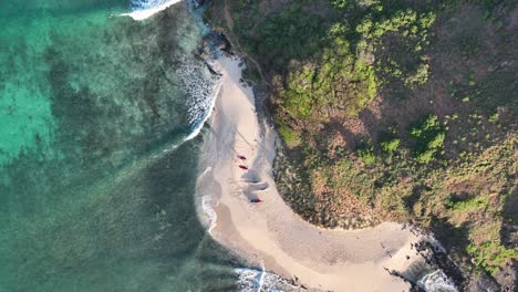 drone-aerial-pan-in-on-surfers-on-beach-on-island-in-hawaii-lanikai-hawaii-beautiful-sunrise
