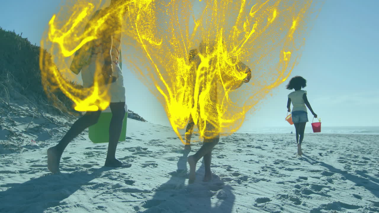 Family group walking barefoot on beach, carrying plastic buckets with digital overlay for marketing