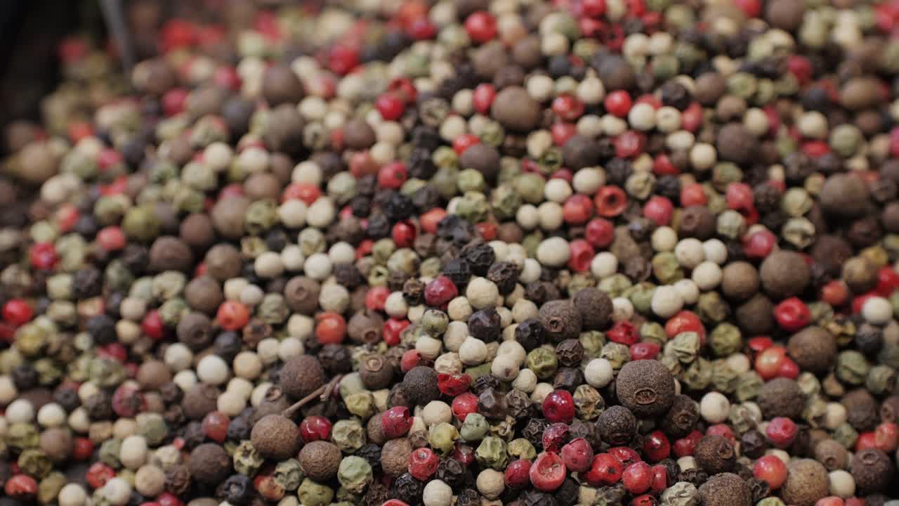 Mix spices dried pink, black pepper, green dill, red paprika, yellow turmeric, garlic, salt close-up macro. A bunch of natural spice for food .Seasonings and condiments concept