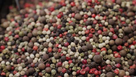 Mix spices dried pink, black pepper, green dill, red paprika, yellow turmeric, garlic, salt close-up macro. A bunch of natural spice for food .Seasonings and condiments concept